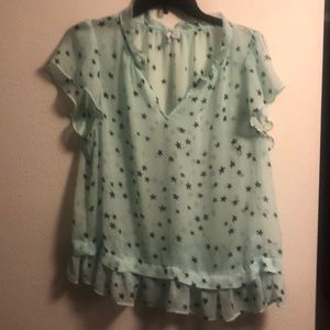 Sheer mint green top with stars.